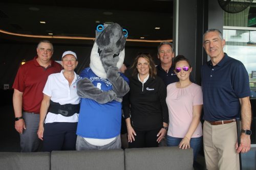 a gathering of people with Shark Twain from the St. Louis Aquarium